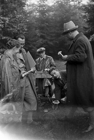 Collectors looking for white mushrooms in the forest, Germany 1930s (b/w photo)