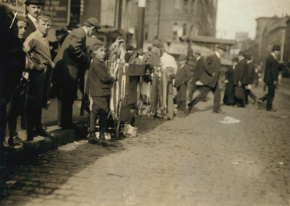 Boys peddling notions on the street in Boston, Massachusetts, 1909 (b/w photo)