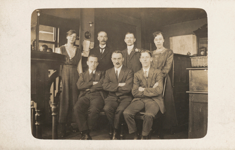 Group of office workers in what is presumably a small family firm (b/w photo)