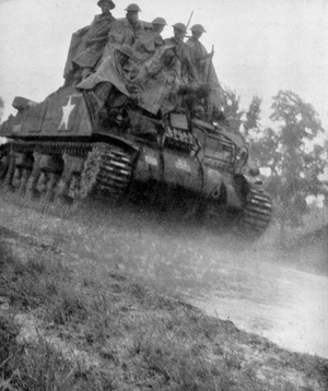 Soldiers Riding a Tank While Trying to Shelter from the Rain, 1942 (b/w photo)