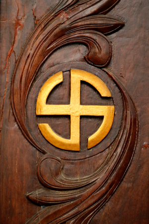 Thien Ung buddhist temple, The swastika a symbol of divinity and spirituality in Hinduism, Buddhism and Jainism Quy Nhon, Vietnam, 2019 (photo)