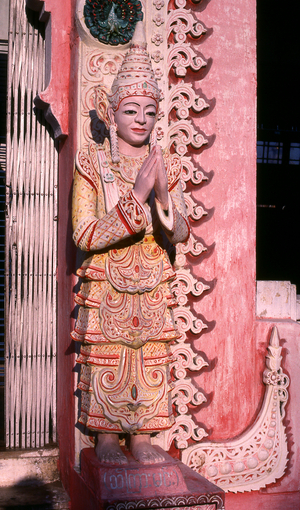 Burma / Myanmar: Figure at the entrance to a small shrine within the Shwedagon Pagoda complex, Yangon (Rangoon)