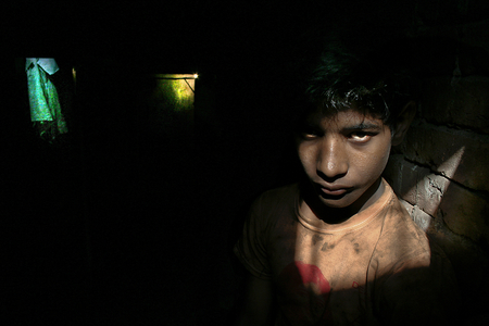 Mojid, a 14 year old boy, works at the dock yard in Sadarghat, Dhaka, for 30 dollars per month. According to UNICEF's Asian Child Labor Report 1999, there are some 40 industries in Bangladesh which use child labor, often under hazardous conditions and with little regard for health and safety. Bangladesh. August 12, 2007.  (photo)