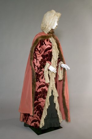 Bertha Palmer's evening coat with attached cape and hood, 1889 (front oblique view), Silk voided velvet in iris pattern, ribbed silk taffeta, lace, beaver fur