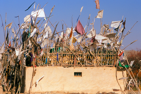 China: A tomb in the sand dunes near the Imam Asim Mazar (shrine) in the desert near Khotan, Xinjiang Province