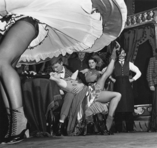 Kissing couple behind blowing dance skirt, England, Great Britain, 1967 (photo)