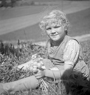 A little girl in the mountains of Austria, 1930s (b/w photo)