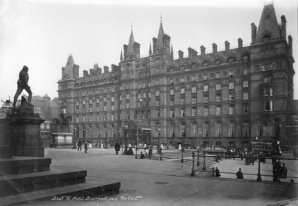The impressive facade of the London and North Western Hotel in Liverpool with pedestrians in the square before it, London And North Western Hotel, Liverpool, UK, 1890-1910 (b/w photo)