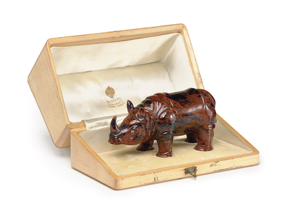 A carved jasper model of a rhinoceros, c. 1900 (jasper, diamonds, silk and velvet lined wood case)