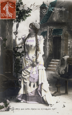 Vintage, French, postcard depicting a pensive woman in a yellow medieval costume, 1900