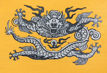 Chinese dragon emblem on a yellow background; from a 1900 illustration