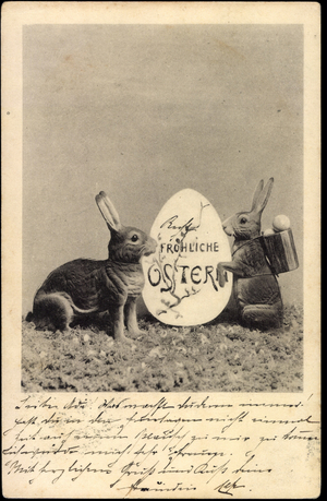Happy Easter, Easter bunny with basket on the meadow, egg