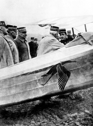 Airman Georges Guynemer (1894-1917) commander of the Stork Flight here near his plane Spad (adorned with a stork) receiving his 3rd Galon d-g: Georges Guynemer, Marechal Louis Lyautey Minister of War, Marechal Ferdinand Foch, General Gerard and General Guillerrin in 1916 (he disappeared in flight on September 11, 1917) - French famous pilot Georges Guynemer commanding the Storks Squadron is decorated by French officers and minister of war Louis Lyautey, Ferdinand Foch, 1916