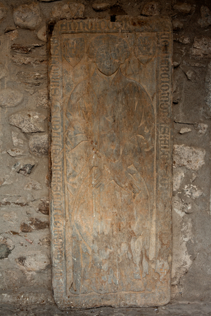 Cathedral. The cloister. A tombstone.