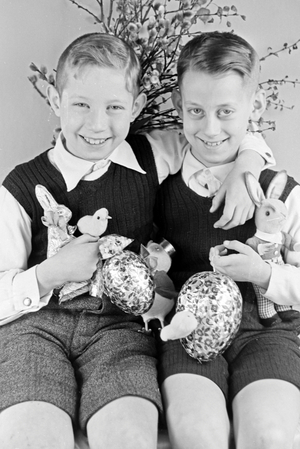 Two boys at a table with easter decoration, Germany 1930s (b/w photo)