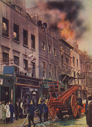 Firemen fighting a blaze from the roof of an adjoining building (coloured photo)