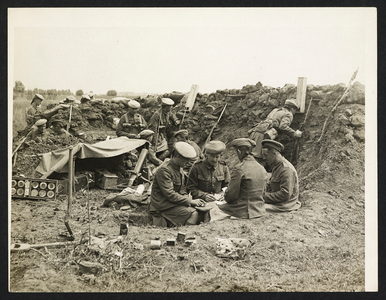 A Bomb Gun Section. An easy time in the trenches [St Floris, France]. Men of the 1st Seaforth Highlanders relaxing in their trench
