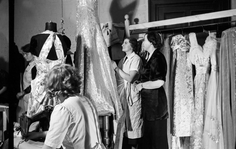 Tailors and sewing machines running hot for the wardrobe of the princess of carnival in Mainz 1938, on the occasion of the 100th anniversary of the leading local carnival association (b/w photo)