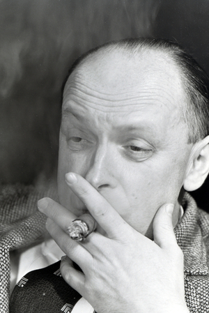 A man smoking a cigar for an advertising campaign, Germany 1930s (b/w photo)