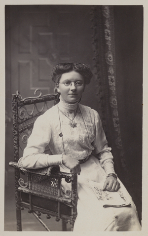 Pretty girl, wearing glasses (b/w photo)