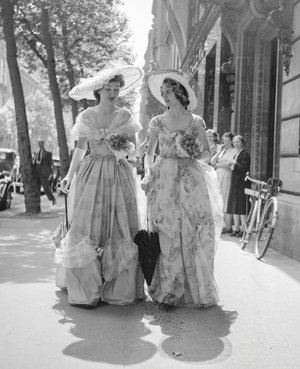 Festivity on Victor Hugo avenue in Paris on June 9, 1950 : women dressed with romantic dresses (tribute to Victor Hugo) (b/w photo)