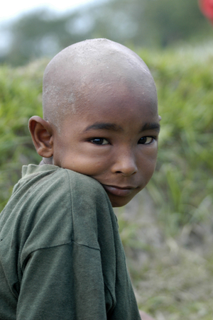 A little boy with shaved head, in Kaliganj in Gazipur, Bangladesh. June 1, 2007.  (photo)