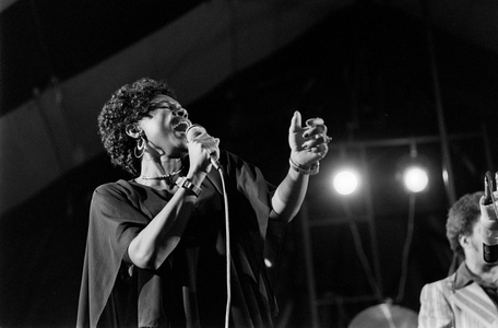 Black and white photo of a jazz singer performing with an American jazz band led by Di…, c.1970 (photo)