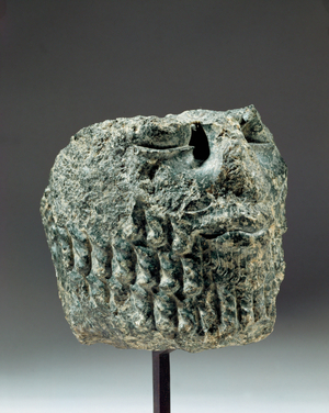 Fragment of a male head with beard …
