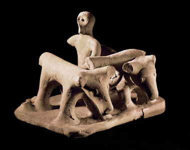 Farmer ploughing with two oxen