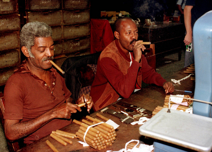 Workers at a cigar factory in Havana smoke the hand-rolled cigars while working..., 1995 (photo)