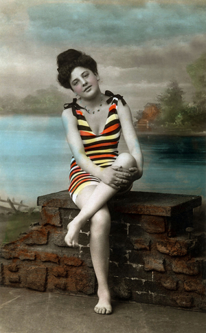 A bather wearing swimsuit, c. 1910, postcard