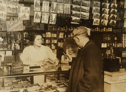 A fourteen-year old vendor at a cigar store in Boston, Massachusetts, 1917 (b/w photo)