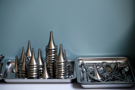 Medical instruments sitting on doctors desk.  France.
