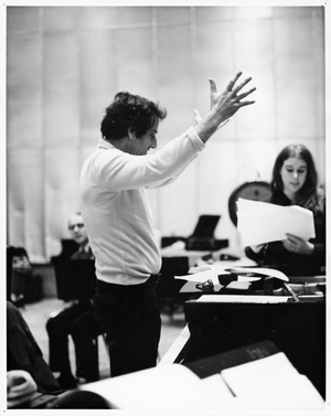 Lukas Foss, composer and conductor, conducting rehearsal with singers, c