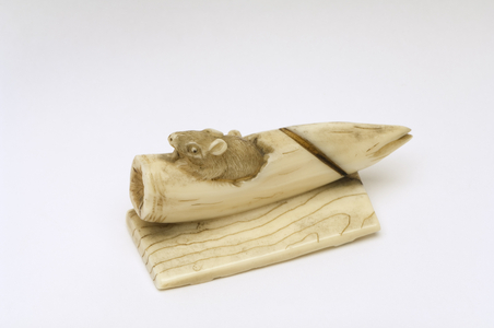 Netsuke of a mouse emerging from a bamboo shoot (ivory)