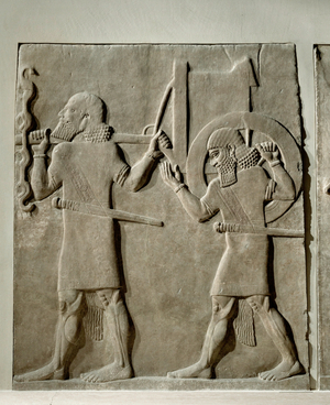 Servants carrying implements for the royal hunt …