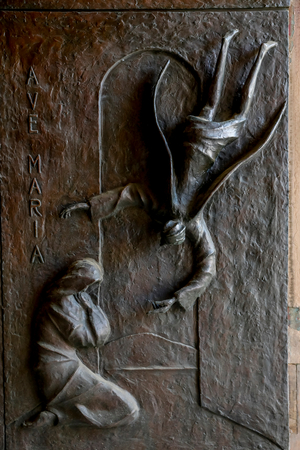 Relief on a door of the Annunciation Roman catholic basilica, Nazareth, Galilee, Israel. The Annunciation. (photo)