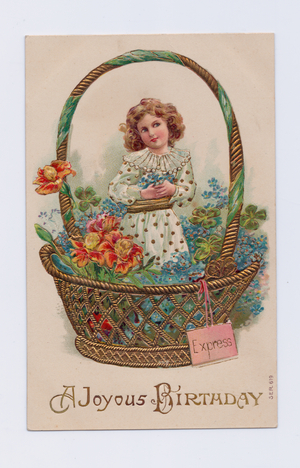 Edwardian birthday postcard of a girl in a basket of flowers, c.1910 (colour litho)