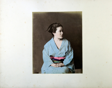 Girl in blue dress, 19th century (hand-coloured b/w photo)