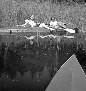 Two young women at a boardwalk on the shore of a lake in the Wachau area, Germany 1930s (b/w photo)