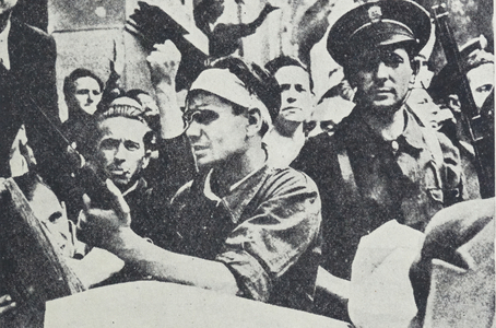 Nationalist soldiers advance during the Siege of Cuartel de la Montaña