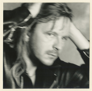 French singer Renaud (Renaud Sechan) posing for "Marchand de cailloux" album cover, 1991 (photography)