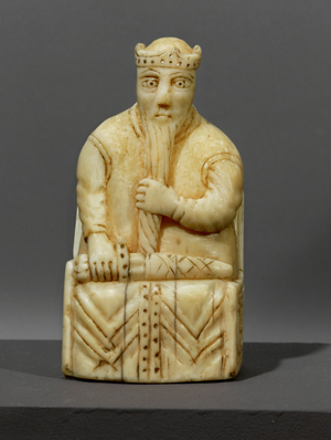 Pawn, a king holding his beard …