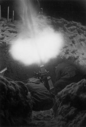 German Soldiers Firing an Artillery Piece, 1942 (b/w photo)