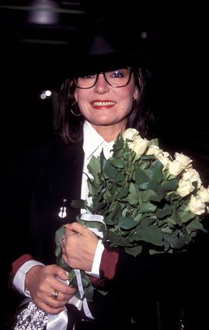 Singer Nana Mouskouri (GRE) is holding a bouquet of white roses,..., 1992 (photo)