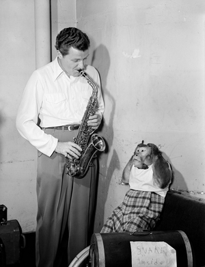 Charlie Barnet (1913-1991) American Jazz musician and Bandleader with his Pet Monkey Re-Bop c.1946 (b/w photo)