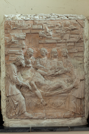 Parish church (Eglise Saint-Pierre). Bas-relief from the rood screen (jubé) damaged by fire in 1940.. bas-relief: l'ensevelissement.