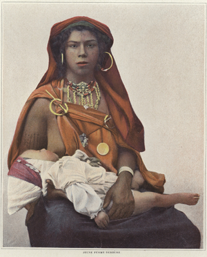 A young Berber woman breastfeeding her baby (colour litho)