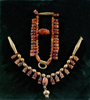 Two necklaces with lotus seed vessels, gold and carnelian beads of different shapes