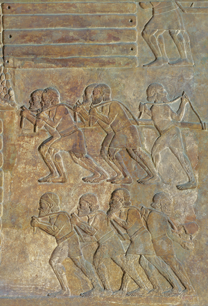 Detail of a relief depicting the stocking up of wood on the shore before transportation by sea, from the Palace of Sargon II, Khorsabad, Iraq (stone)